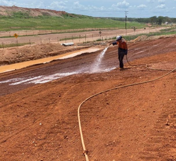 Man Spraying Dirt — Vital Erosion Control Products in Northern Territory